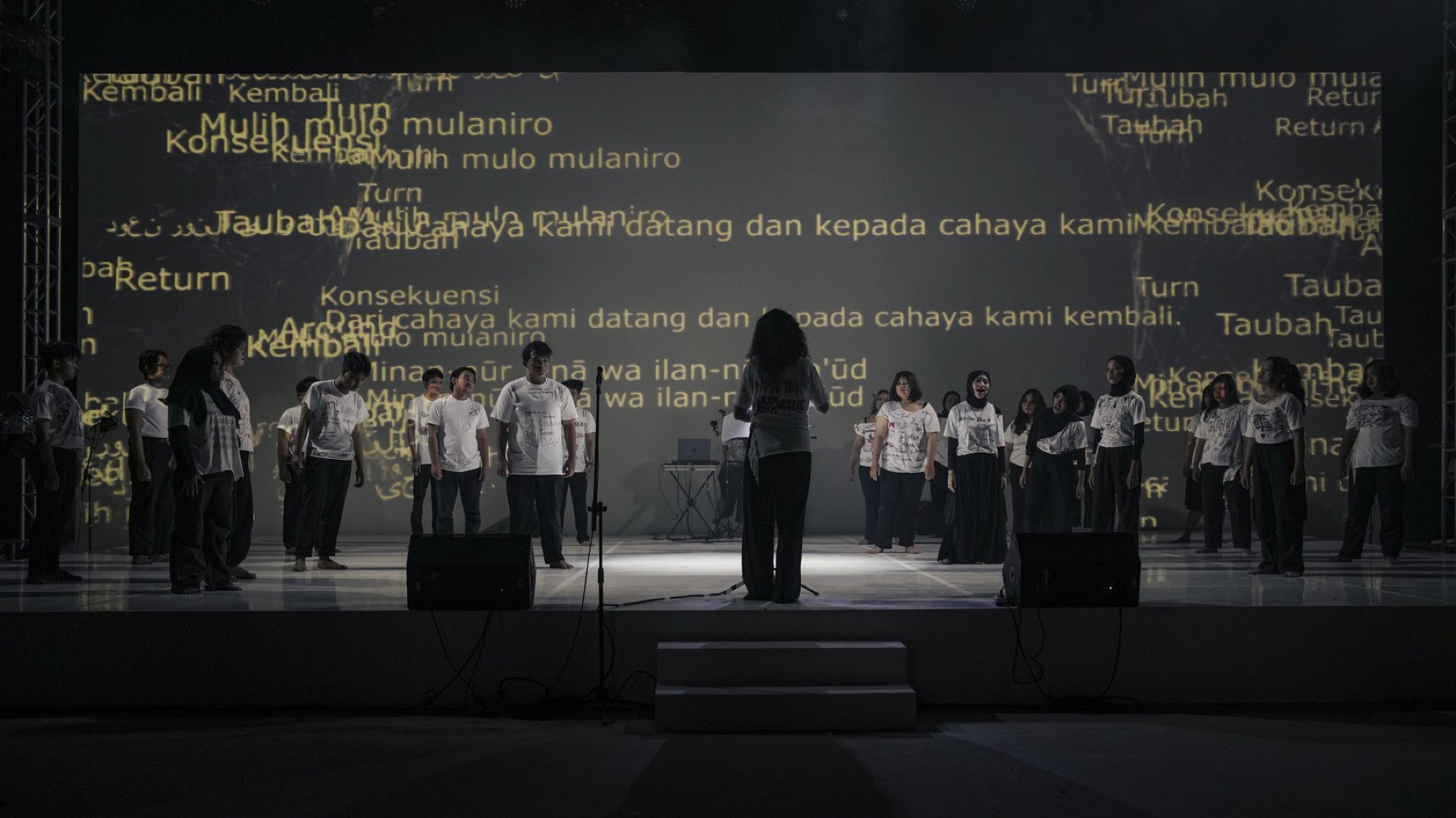 GUILTY — the Serenata Choir of ISI Yogyakarta performing under projected text, opening night ARTJOG 2026.